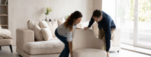 photo-of-man-and-woman-moving-couch