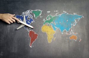 tips for travelling abroad for work. Map with plane.