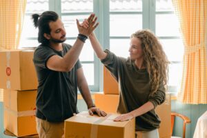 Man and woman moving home